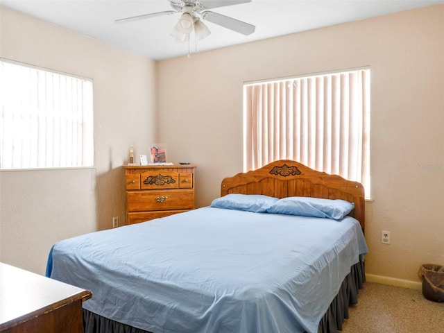 bedroom with carpet, baseboards, and ceiling fan