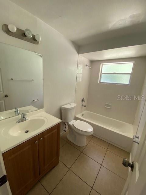 full bath with toilet, bathing tub / shower combination, tile patterned flooring, and vanity