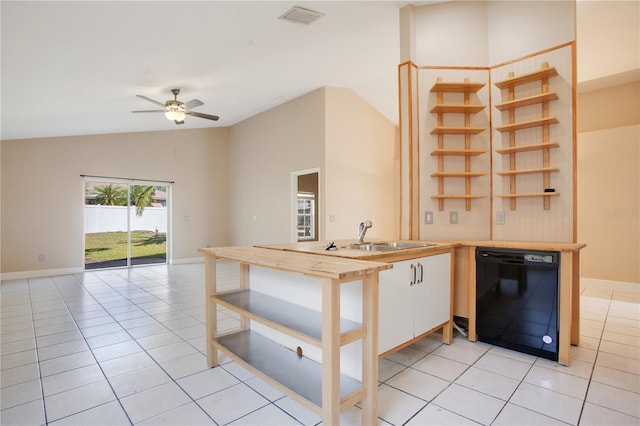 kitchen with dishwasher, open shelves, light tile patterned floors, and a sink