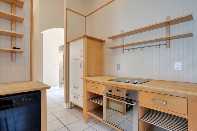 kitchen featuring wood counters, black appliances, and open shelves