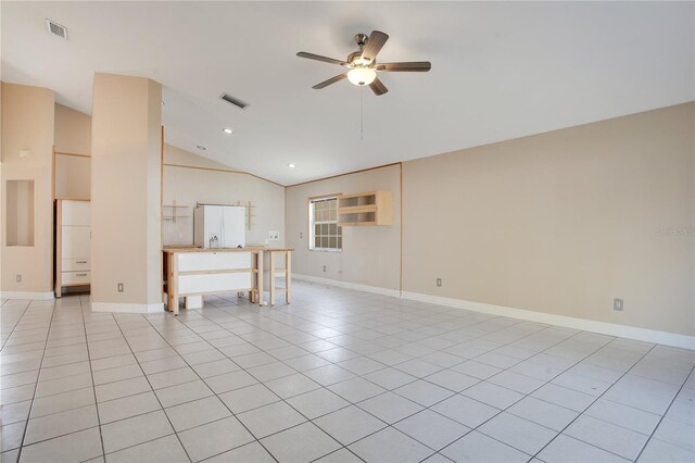 unfurnished living room with lofted ceiling, ceiling fan, visible vents, and light tile patterned flooring