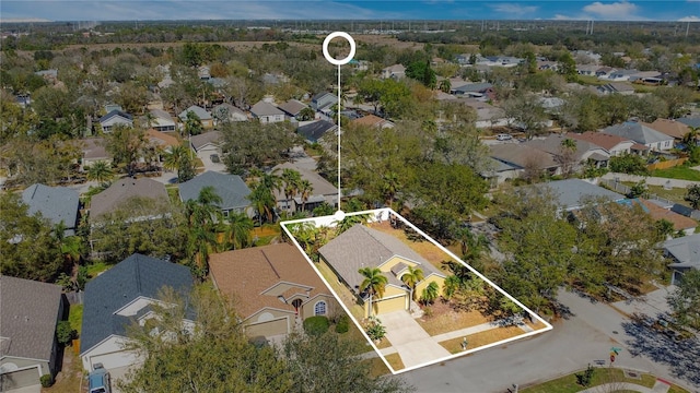 birds eye view of property with a residential view