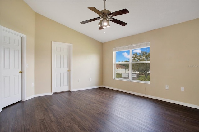 unfurnished bedroom featuring vaulted ceiling, ceiling fan, dark wood-type flooring, and baseboards