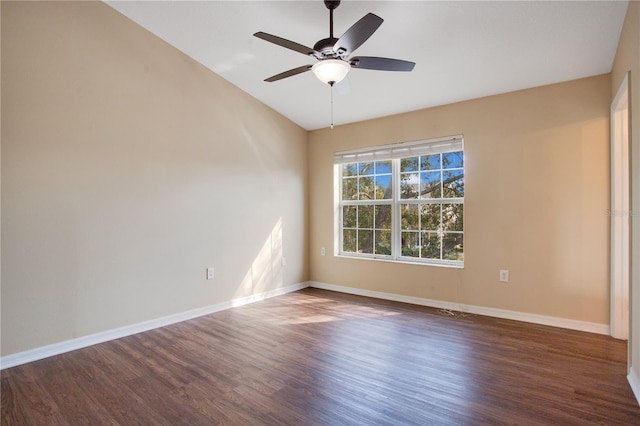 unfurnished room with ceiling fan, baseboards, and wood finished floors