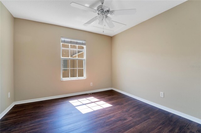 unfurnished room with ceiling fan, baseboards, and wood finished floors