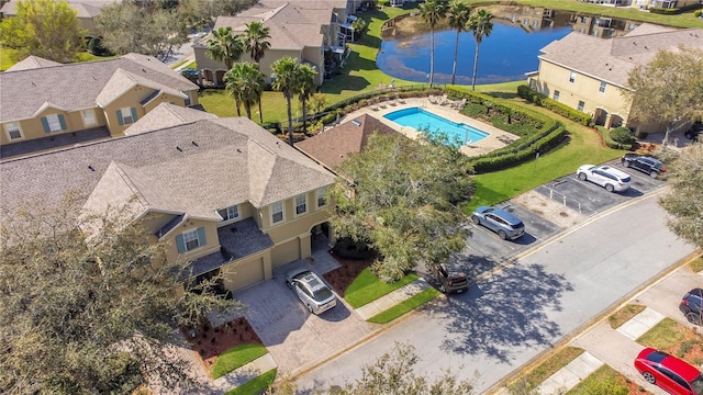 bird's eye view featuring a water view and a residential view