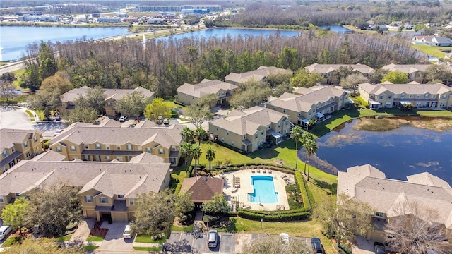 bird's eye view with a water view and a residential view