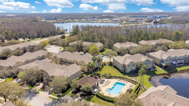 bird's eye view with a residential view and a water view