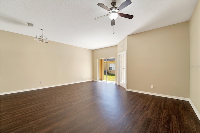 empty room with visible vents, baseboards, dark wood-type flooring, a textured ceiling, and ceiling fan with notable chandelier