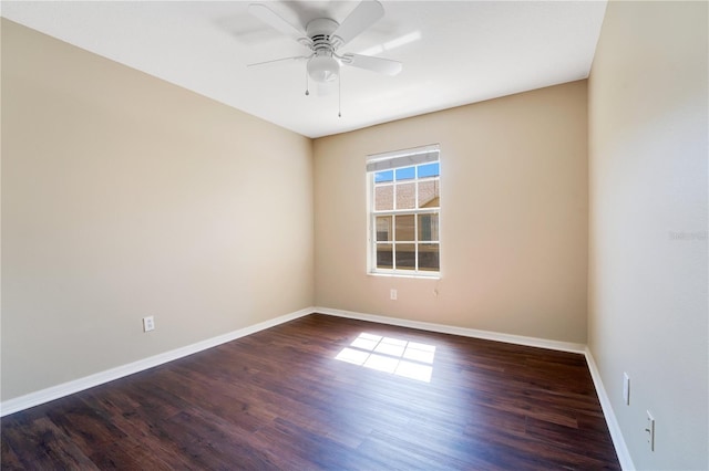 spare room featuring ceiling fan, baseboards, and wood finished floors