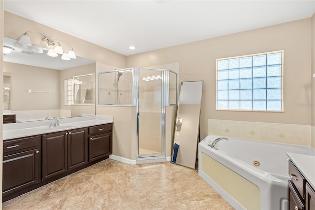 bathroom featuring tile patterned flooring, a shower stall, vanity, and a whirlpool tub