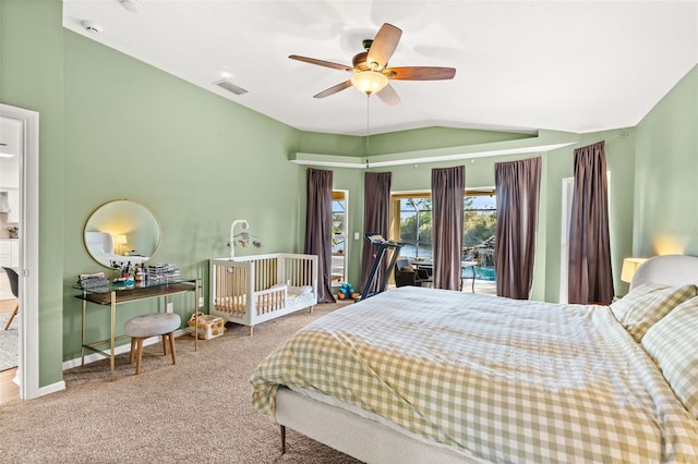 carpeted bedroom with lofted ceiling, a ceiling fan, visible vents, and baseboards