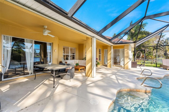 view of patio featuring a ceiling fan, a lanai, and an outdoor pool