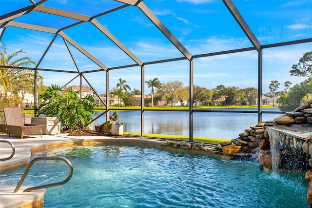 view of pool featuring a patio area, a lanai, and a water view