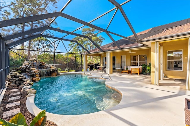 pool featuring a ceiling fan, a lanai, a patio, and an outdoor hangout area