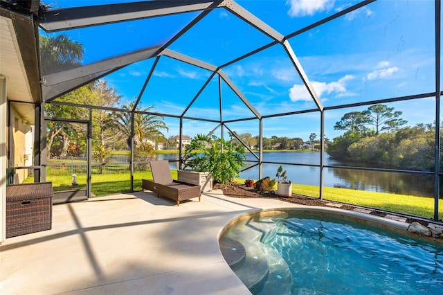 outdoor pool featuring a patio area, a lawn, a water view, and a lanai