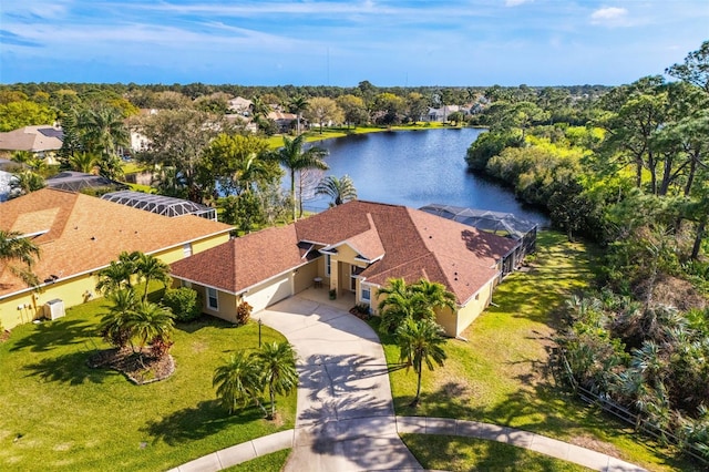 birds eye view of property with a water view