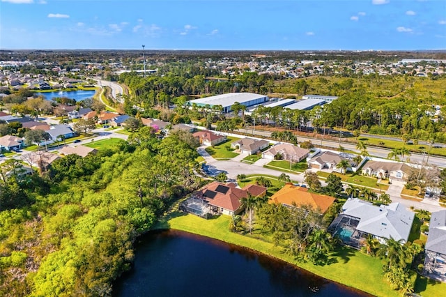 birds eye view of property featuring a residential view and a water view