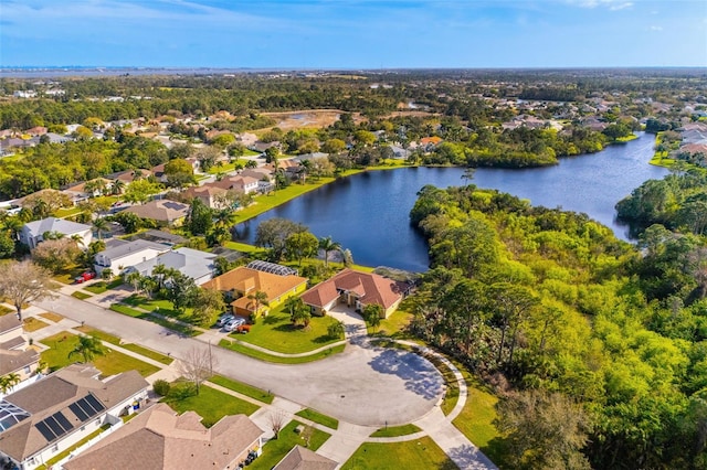 birds eye view of property with a water view and a residential view