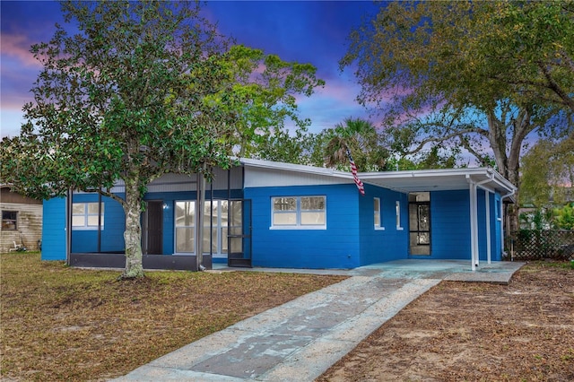 view of front of property featuring a carport