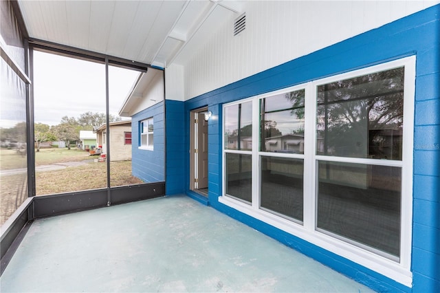 unfurnished sunroom with visible vents