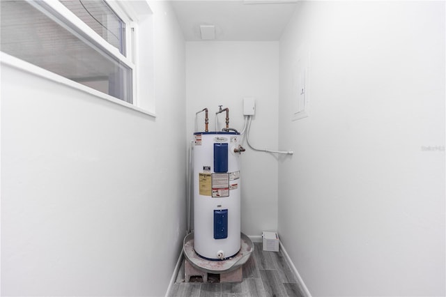 utility room featuring electric water heater