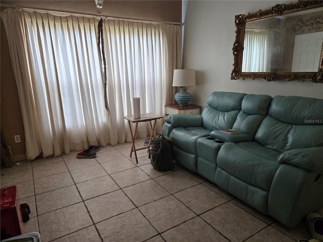 living room with tile patterned floors