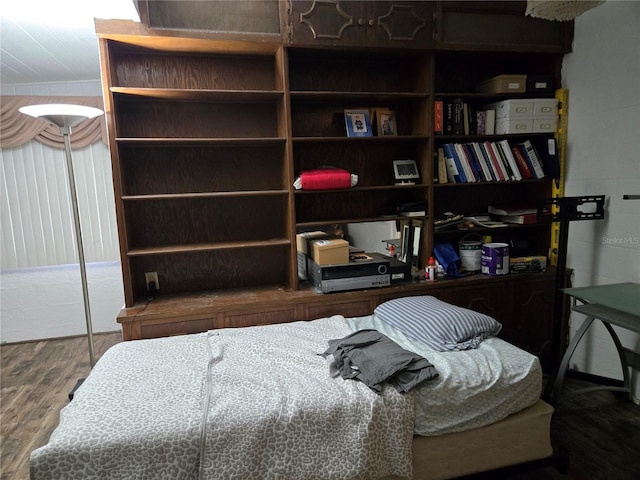 bedroom with wood finished floors