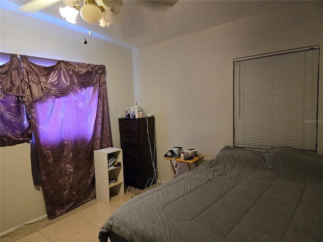 bedroom featuring light tile patterned flooring and ceiling fan