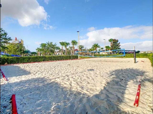 view of home's community featuring volleyball court