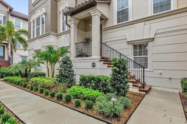 doorway to property with stucco siding