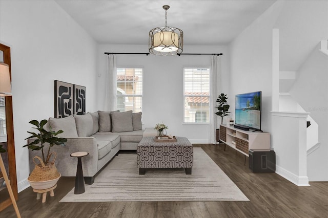 living room featuring baseboards and wood finished floors