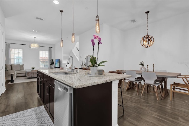 kitchen with a sink, visible vents, dark wood finished floors, and dishwasher