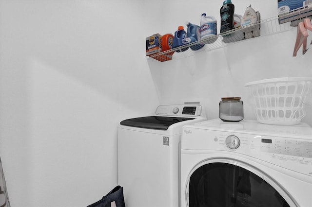 laundry room featuring laundry area and separate washer and dryer