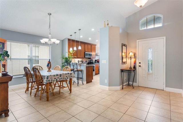 dining space featuring light tile patterned floors, recessed lighting, baseboards, and an inviting chandelier