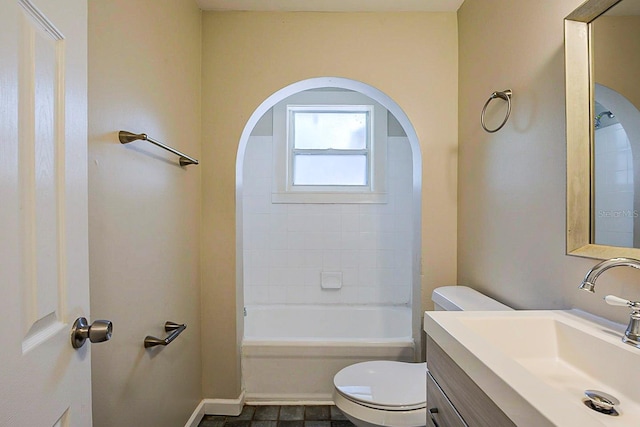 full bath with vanity, toilet, bathtub / shower combination, and baseboards