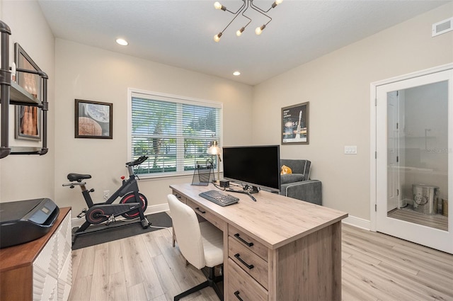 office area with light wood finished floors, baseboards, visible vents, a notable chandelier, and recessed lighting