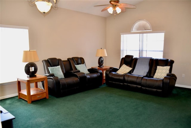 living room with vaulted ceiling, carpet flooring, a ceiling fan, and baseboards