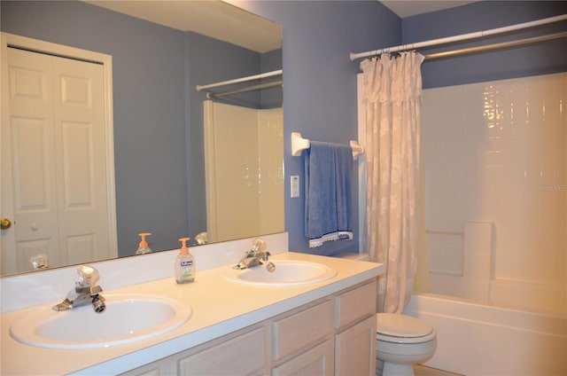 full bathroom with shower / bath combo, a sink, toilet, and double vanity