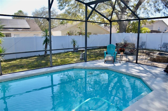 view of pool featuring a patio area, a fenced backyard, and a fire pit