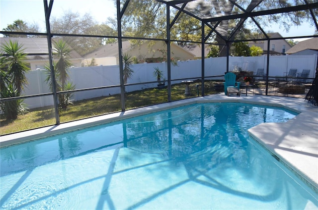 view of pool featuring a fenced in pool, a lanai, a fenced backyard, and a patio