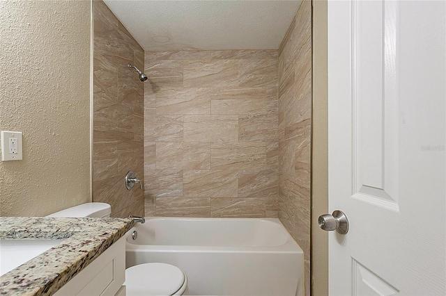 bathroom featuring a textured wall, toilet, a textured ceiling, vanity, and shower / bathing tub combination