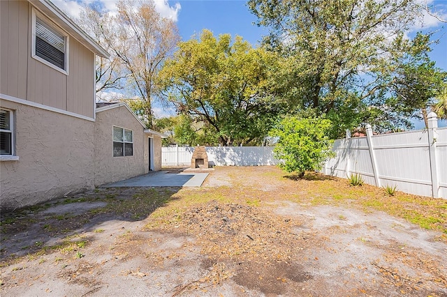 view of yard featuring a patio area and a fenced backyard