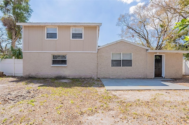 rear view of property with a patio area and fence