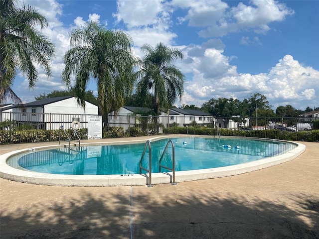 community pool with fence