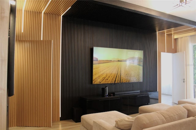 cinema room with beamed ceiling