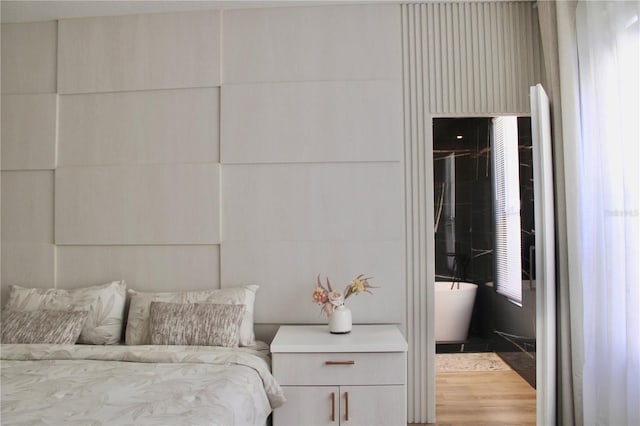 bedroom with wood finished floors