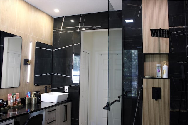 bathroom with tile walls and vanity