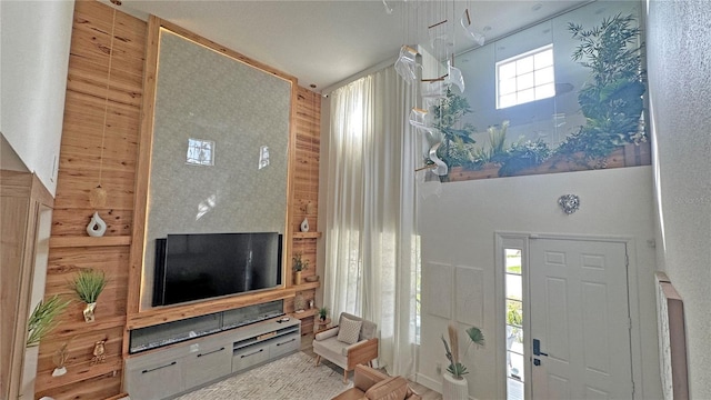 entryway with a towering ceiling