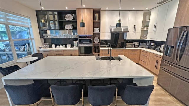 kitchen featuring open shelves, appliances with stainless steel finishes, modern cabinets, and pendant lighting